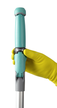 Yellow-gloved hand holding a turquoise and grey adjustable mop handle.