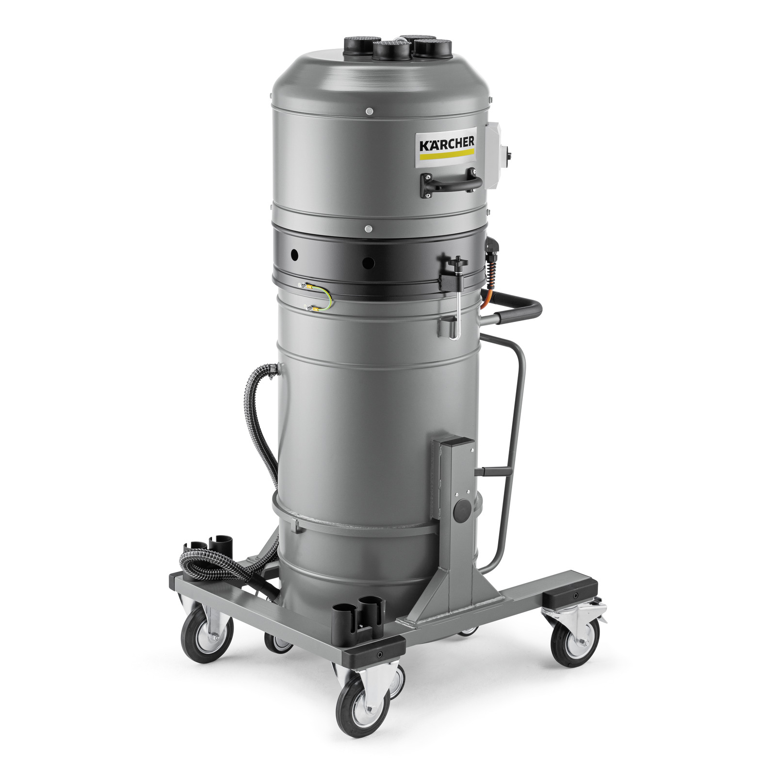 Kärcher industrial vacuum cleaner with a cylindrical metal body, mounted on a wheeled base, featuring control knobs and hoses.